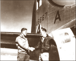 Lucera - T Sgt. Sinclair Red Murphy Aberdeen Wash. being welcomed back from 52 days MIA with Lt. Kagi by Maj. Donald Ewing Eureka ILL.